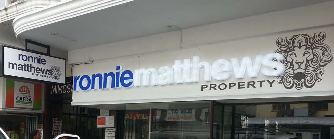 ronnie matthews property shop front sign